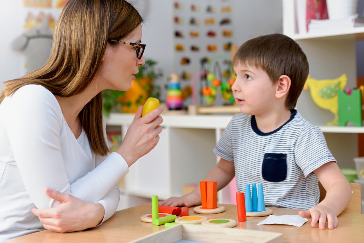 Therapist working with child during ABA therapy session